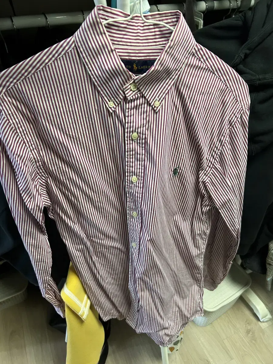 I am selling a Polo wine colored striped shirt (size S)