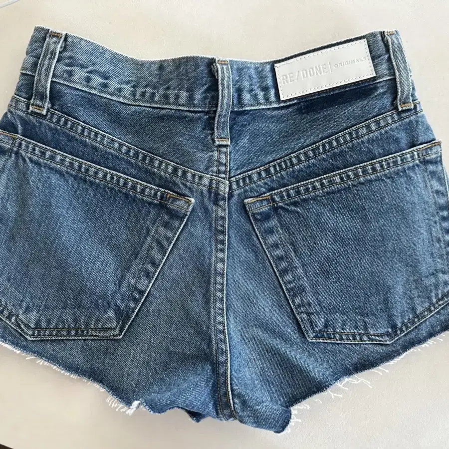 RE/DONE The Short Mid Rise Frayed Shorts