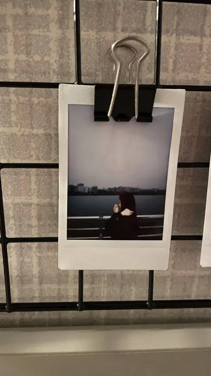 Doon <GOYARD> sells album cover Polaroid photos.