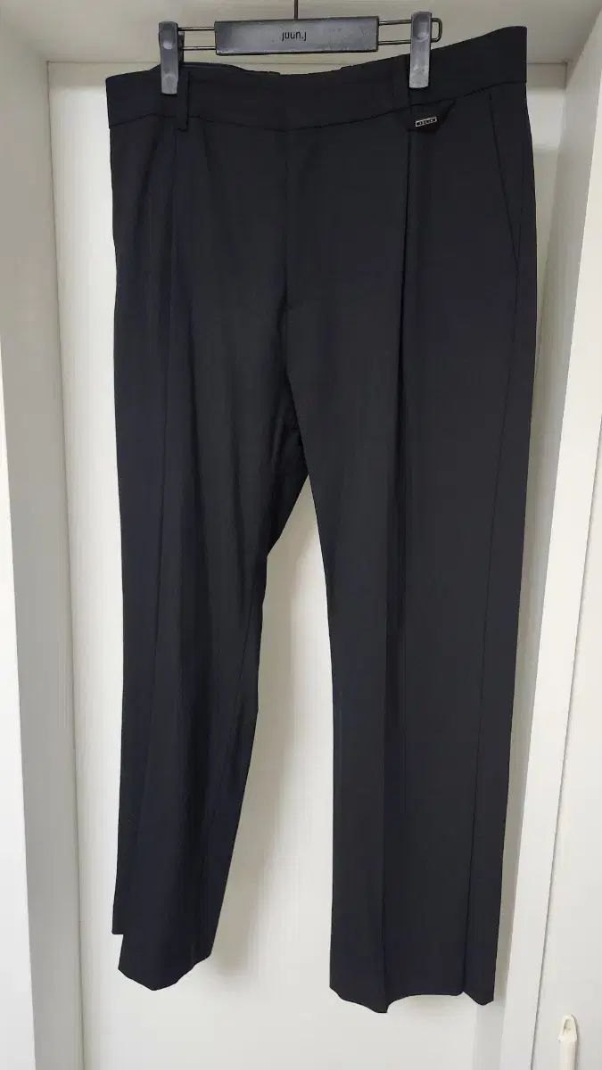 Solid Homme slit button detail pants for sale.