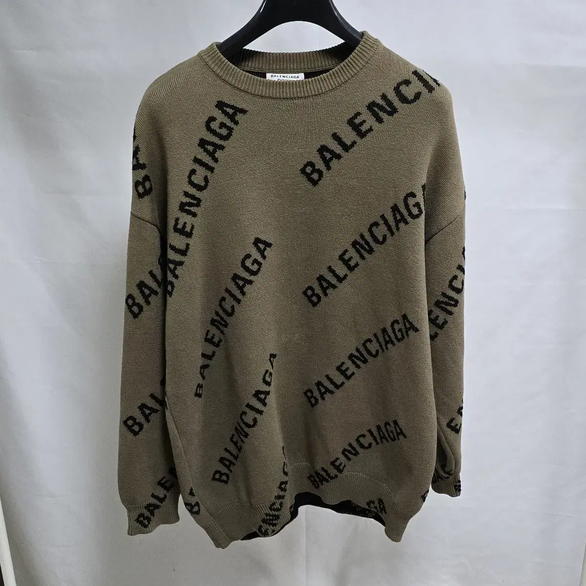 Balenciaga Multi-logo knitted sweater XS sells for 105