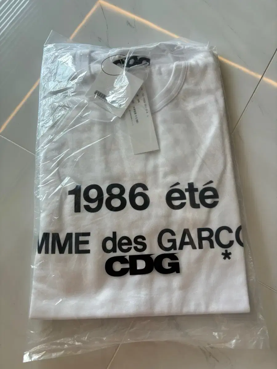 [L] CDG 1986 Comme des Garçons Song T-Shirt White