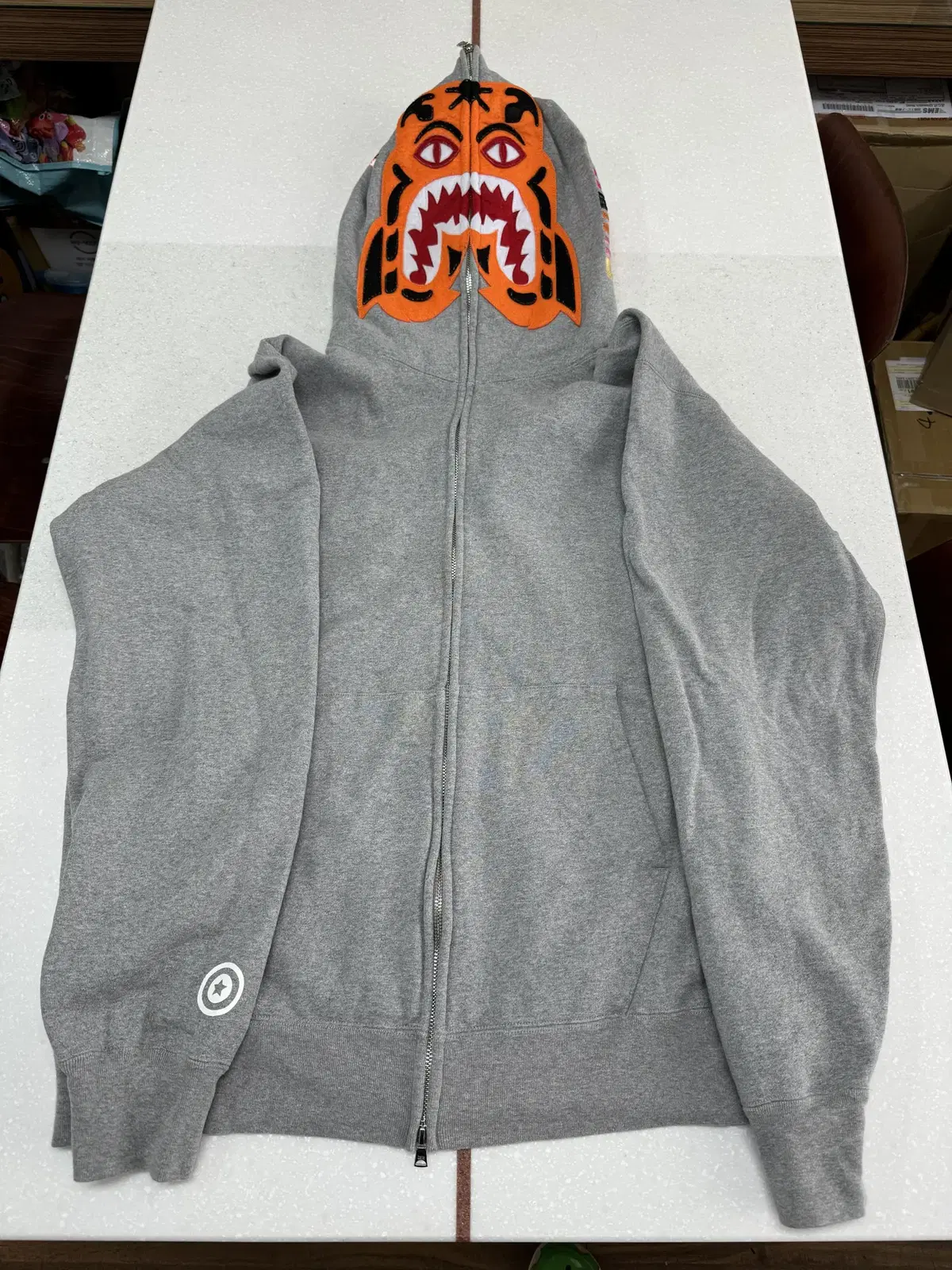 I am selling a Vape Tiger full zip up in size 3XL in gray.