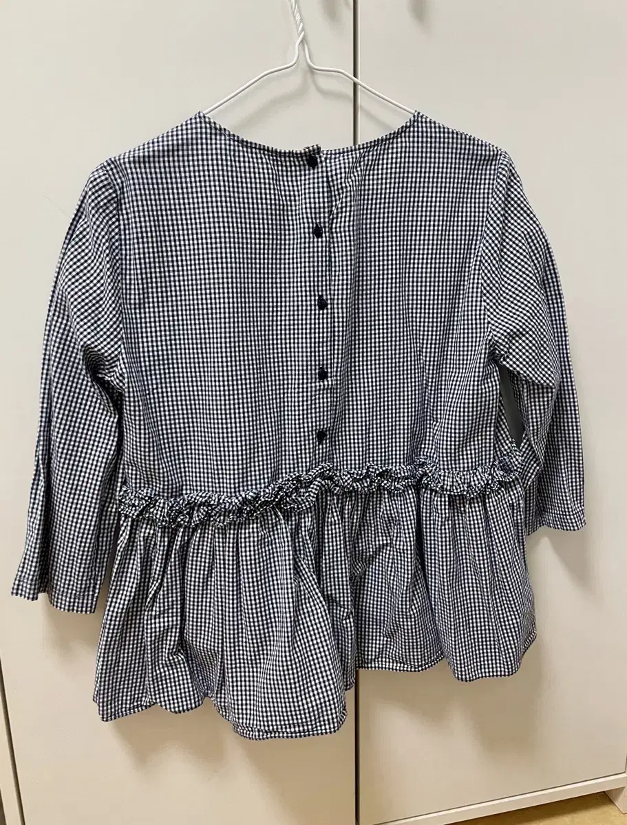 Black check ruffled blouse