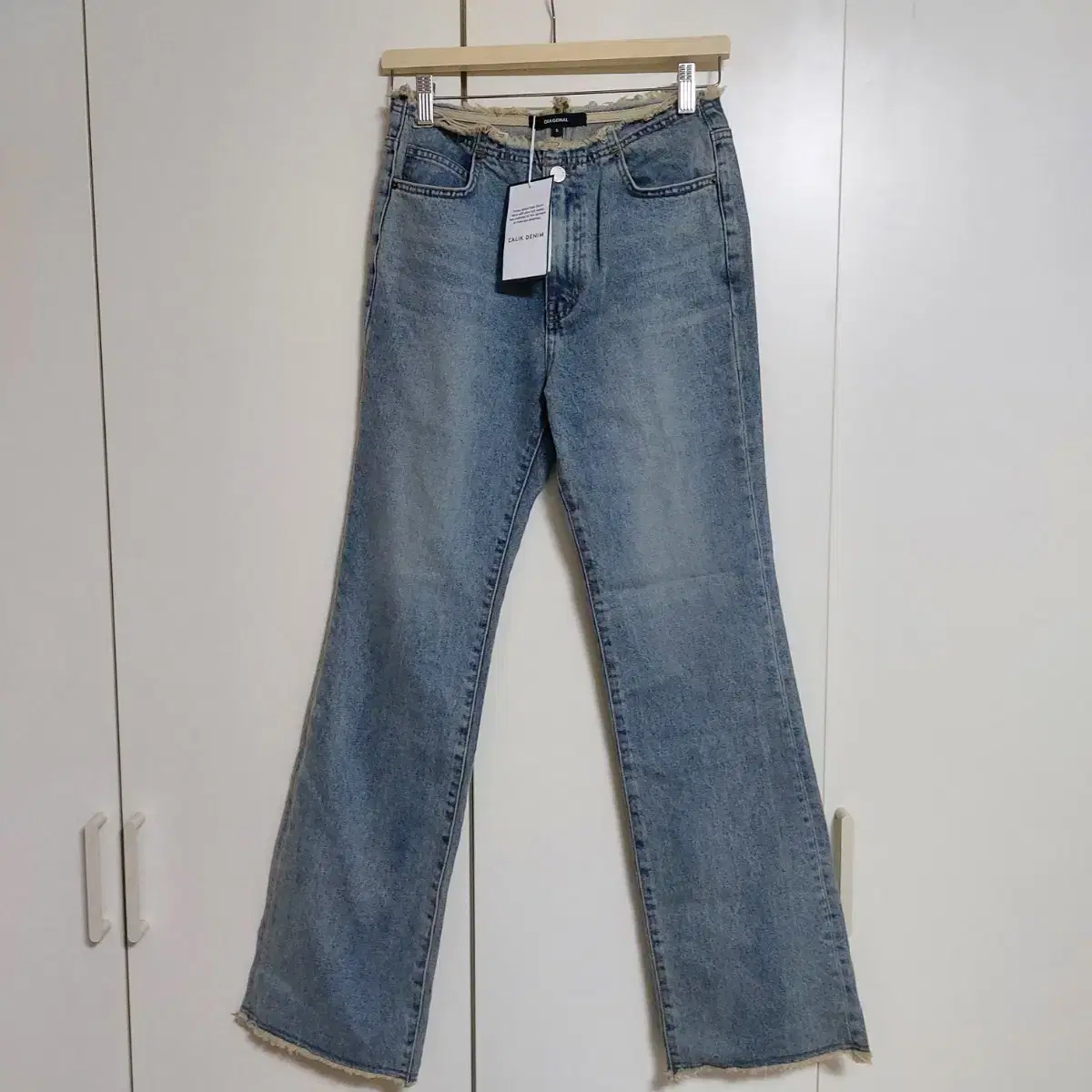 다이애그널 GRUNGE WASHING DENIM PANTS