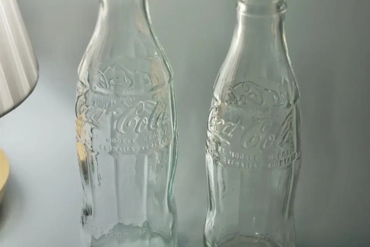 Two types of old-fashioned Coca-Cola transparent bottles Coke Collection Coke