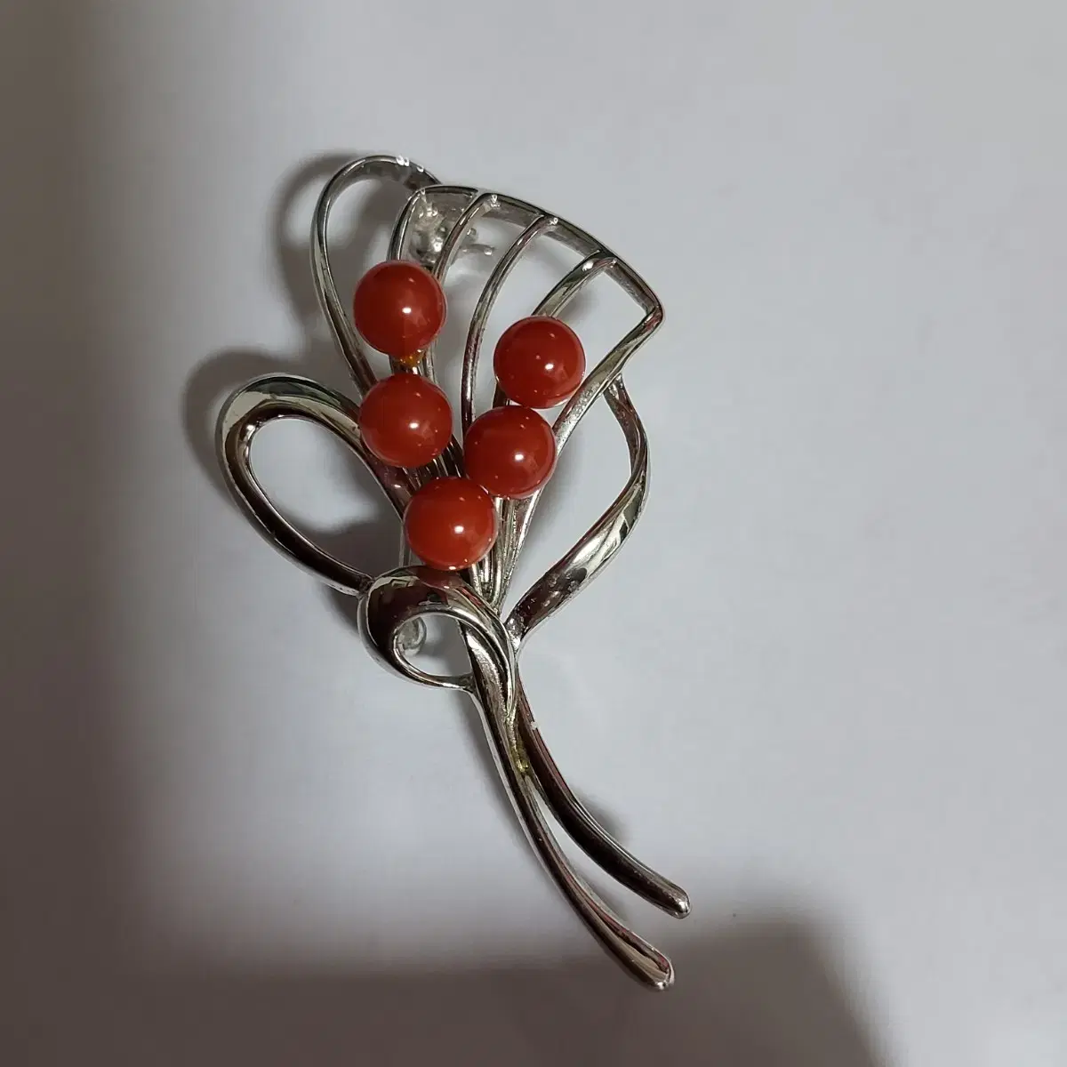 Red natural coral silver brooch