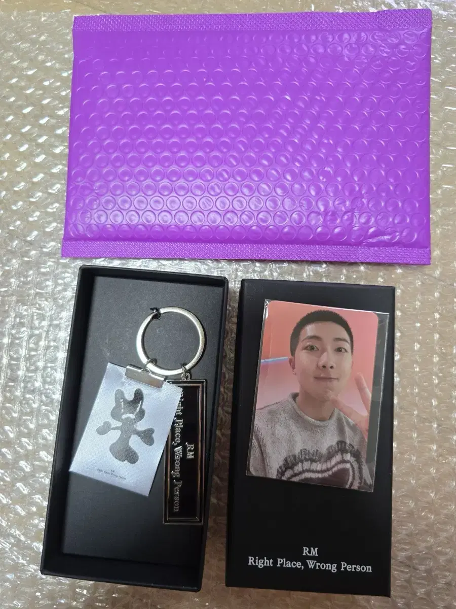 BTS RM Namjoon wins RPWP photocard keyring set for Army Photo Exhibition.