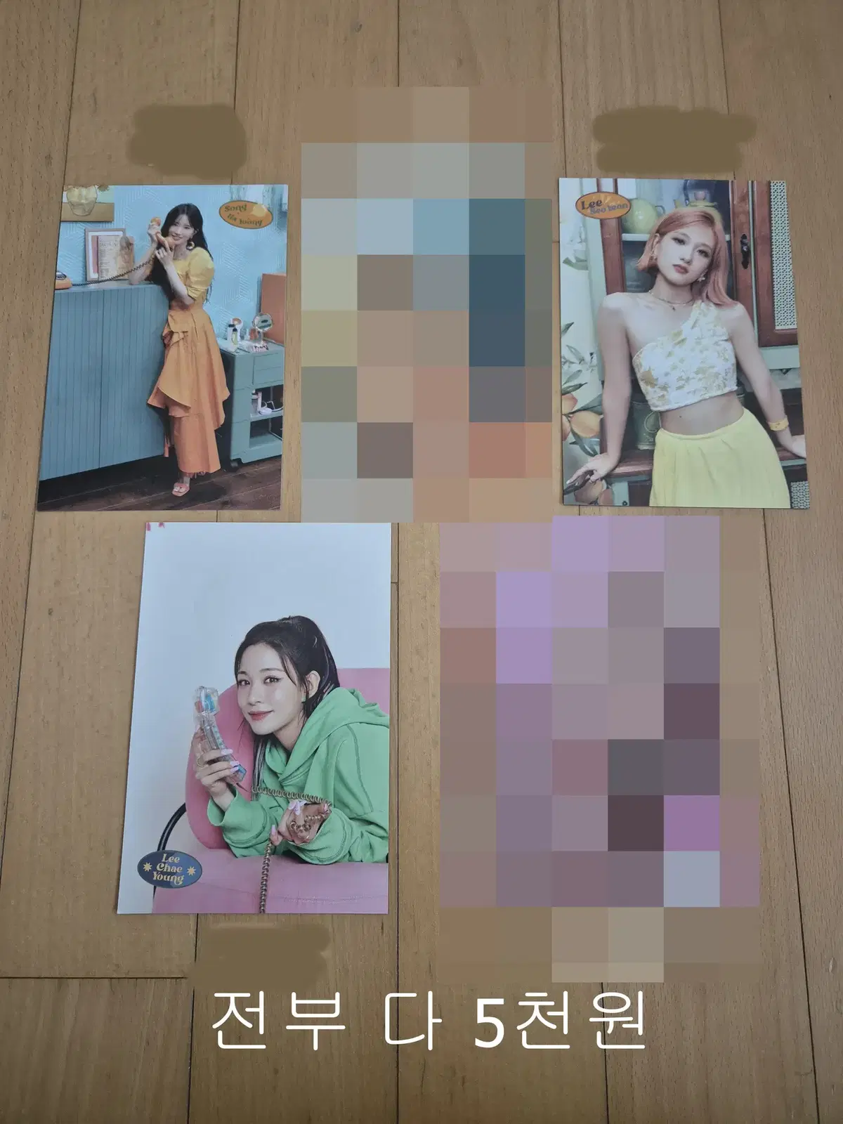 Fromis 9 sells photocards and postcards.