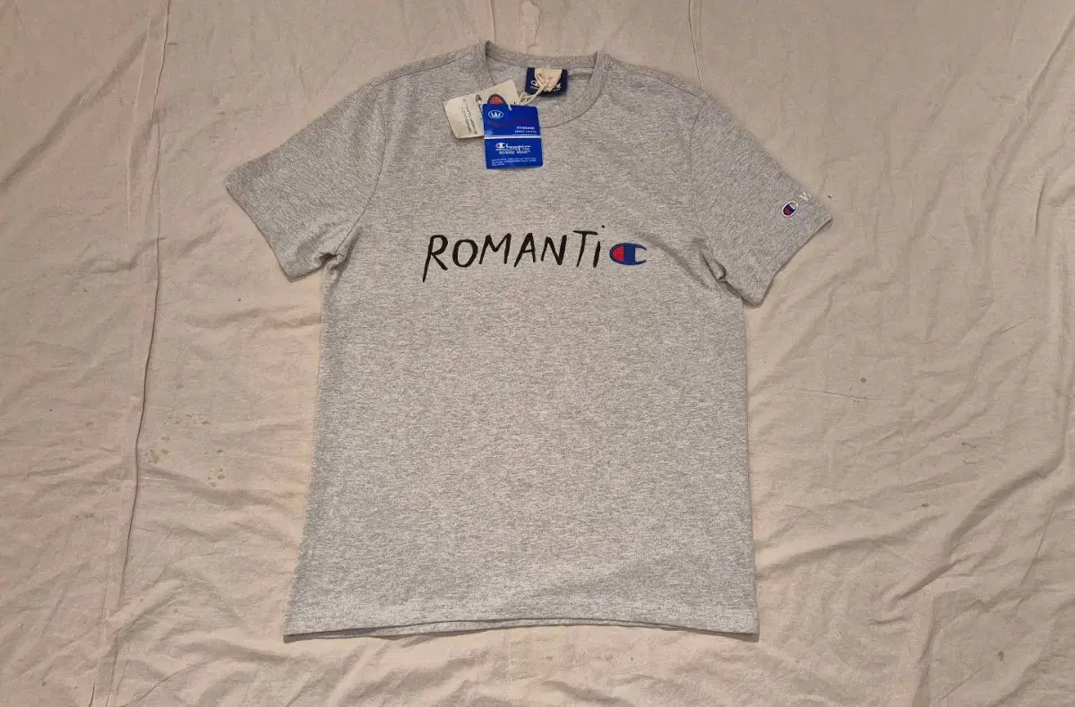 L>Champion X Woodwood Romantic T-Shirt