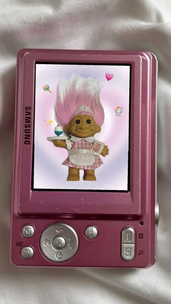 Maid Troll doll holding cake