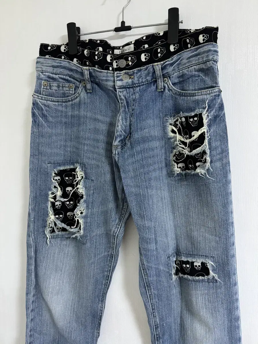 Vintage layered skull pattern patchwork denim pants