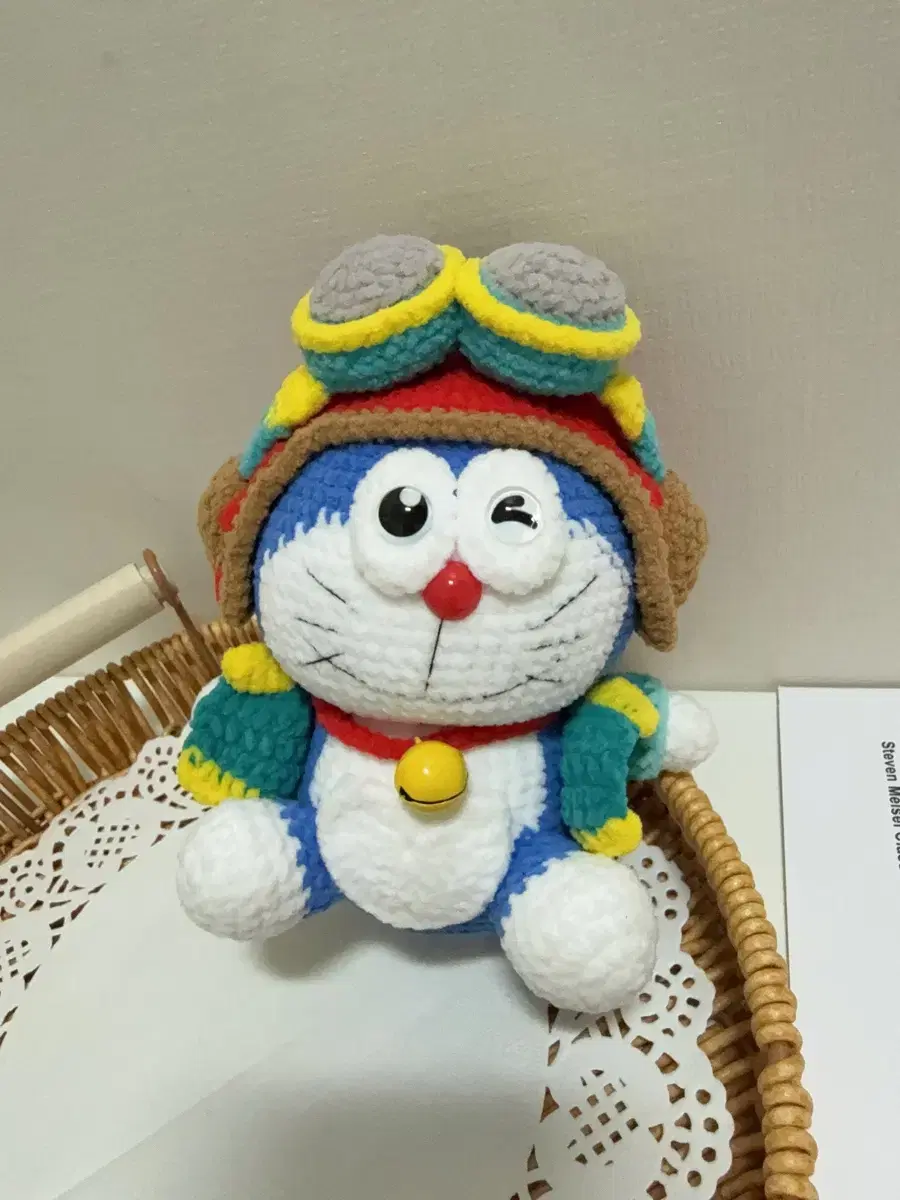 Doraemon in an aviator's uniform, a handmade knitted doll