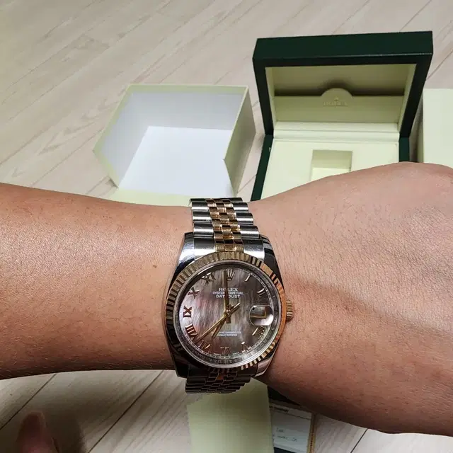 rolex 116231 로즈골드 로만 흑진주자개판 36mm 가격다운