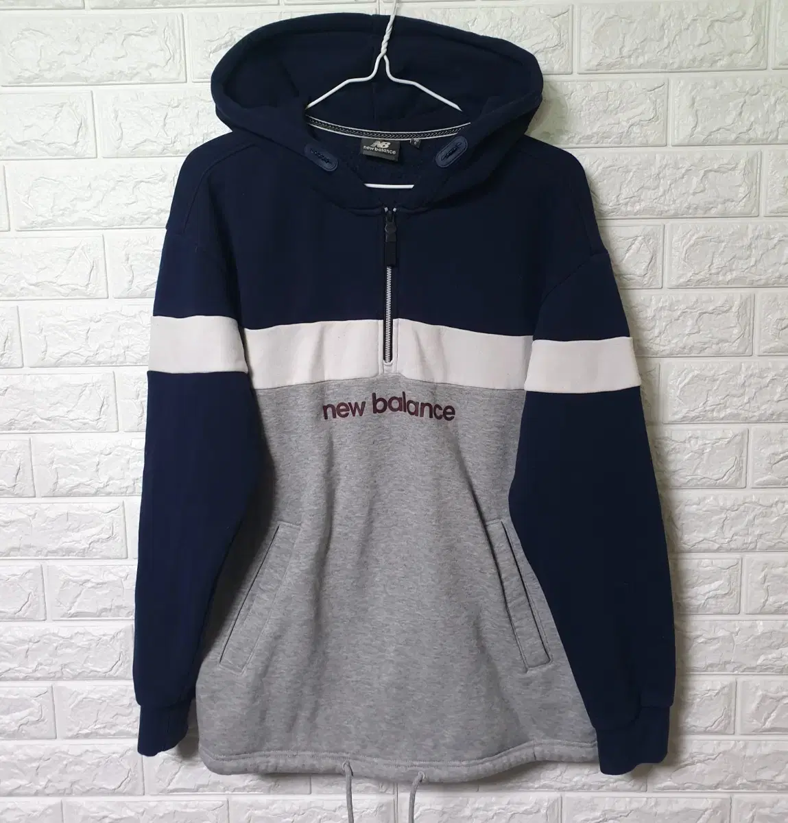 We are selling New Balance Anorak Hoodie T-shirts.