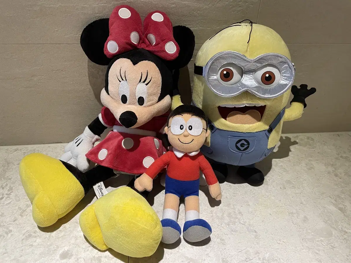 Minions, Mickey Mouse, and Noh Jingu dolls.