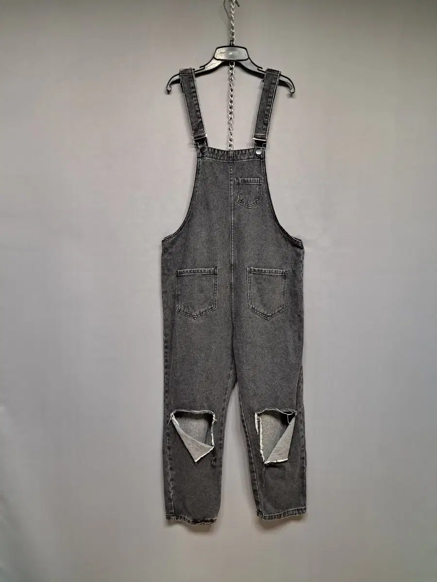 Ripped gray denim suspenders pants