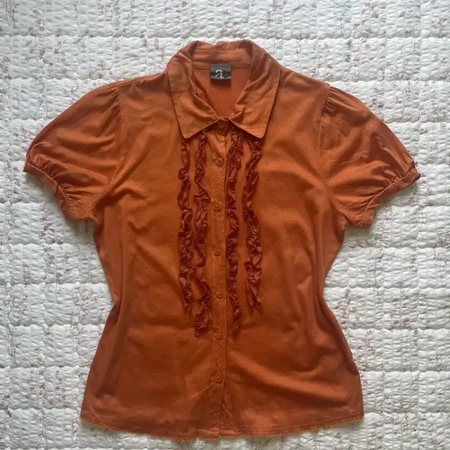 Orange ruffle shirts