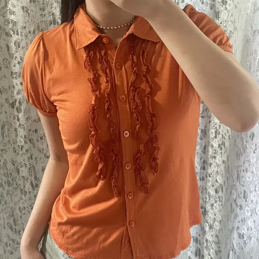 Orange ruffle shirts