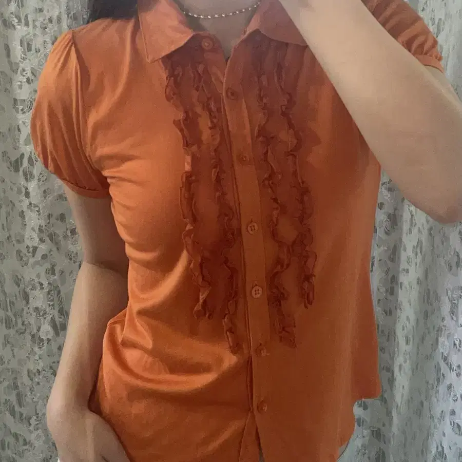 Orange ruffle shirts