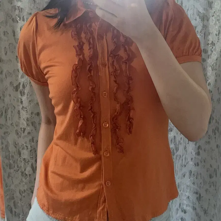 Orange ruffle shirts