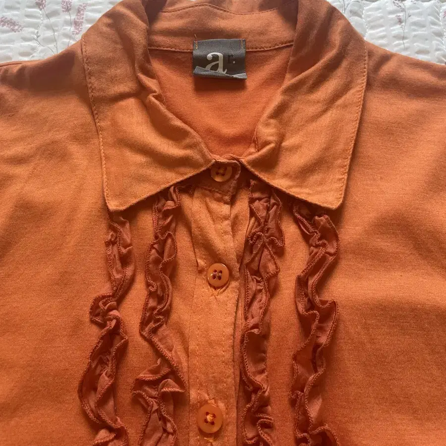 Orange ruffle shirts