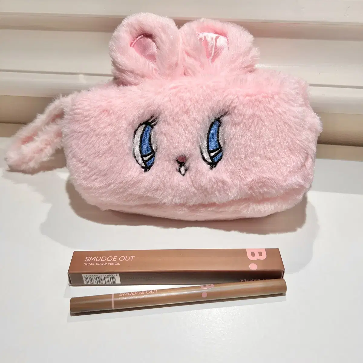 Vanillaco eyebrow pencil in taupe brown with a new bunny pow.