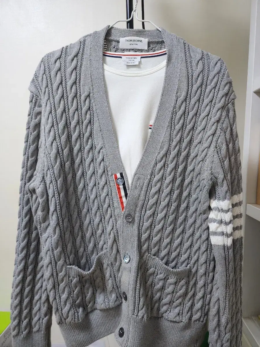 Sells Thom Browne cardigans.