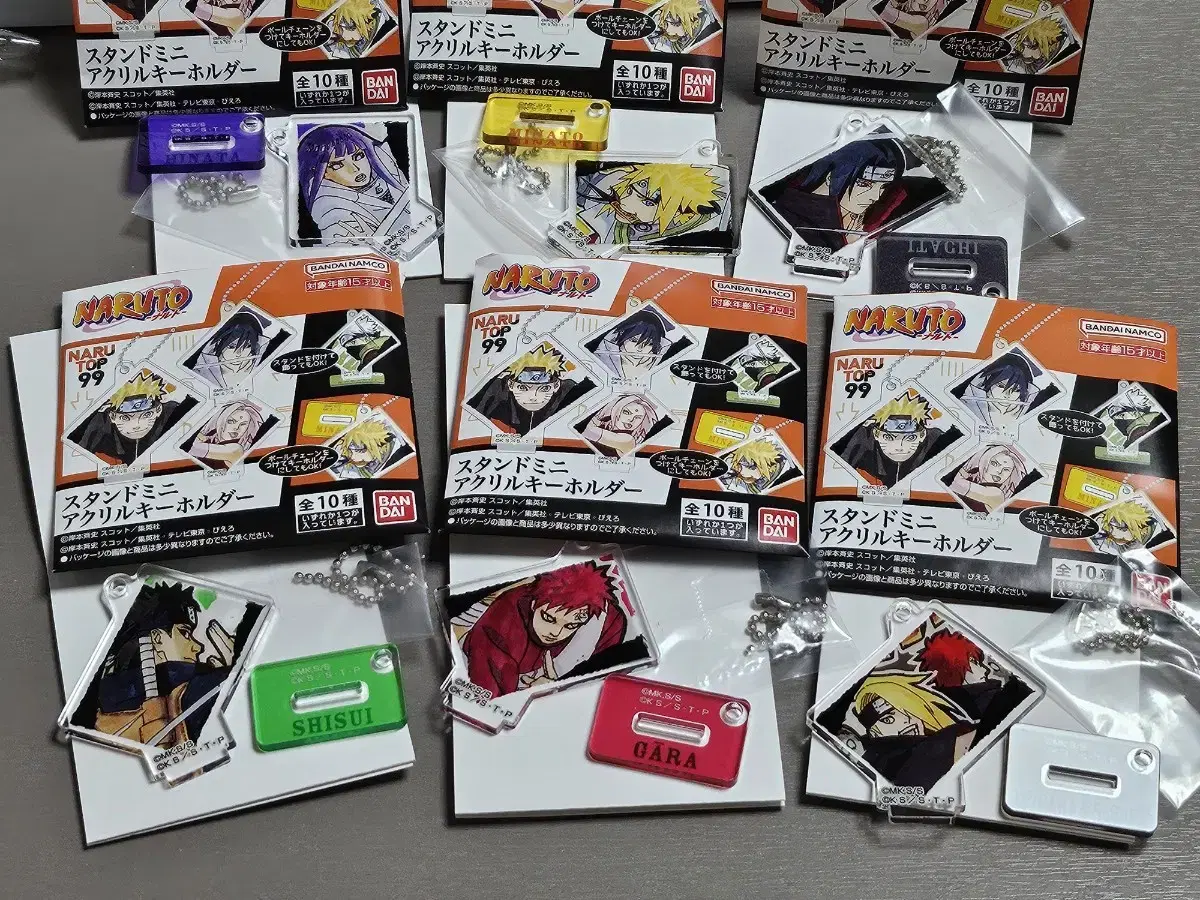 I sell Naruto original art stand mini acrylic keychains.