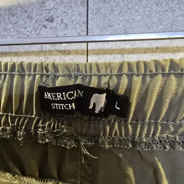 American Stich 멀티 포켓. 경량 테크 팬츠