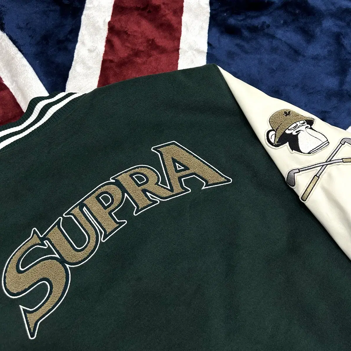 [L]SUPRA 수프라 울 오버핏 바시티