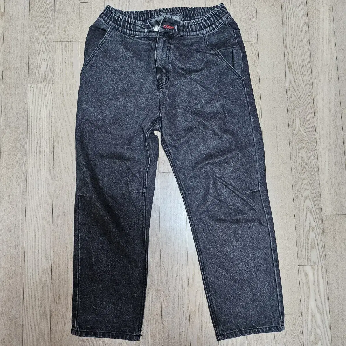 Whiskered black denim pants