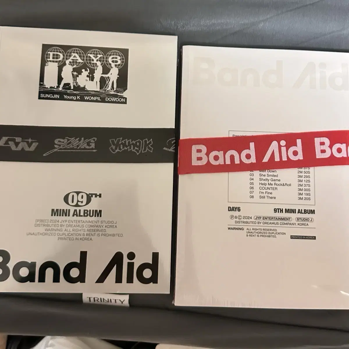 Day 6 Band-Aids sealed album + 4 copies of poster (duplicate X)