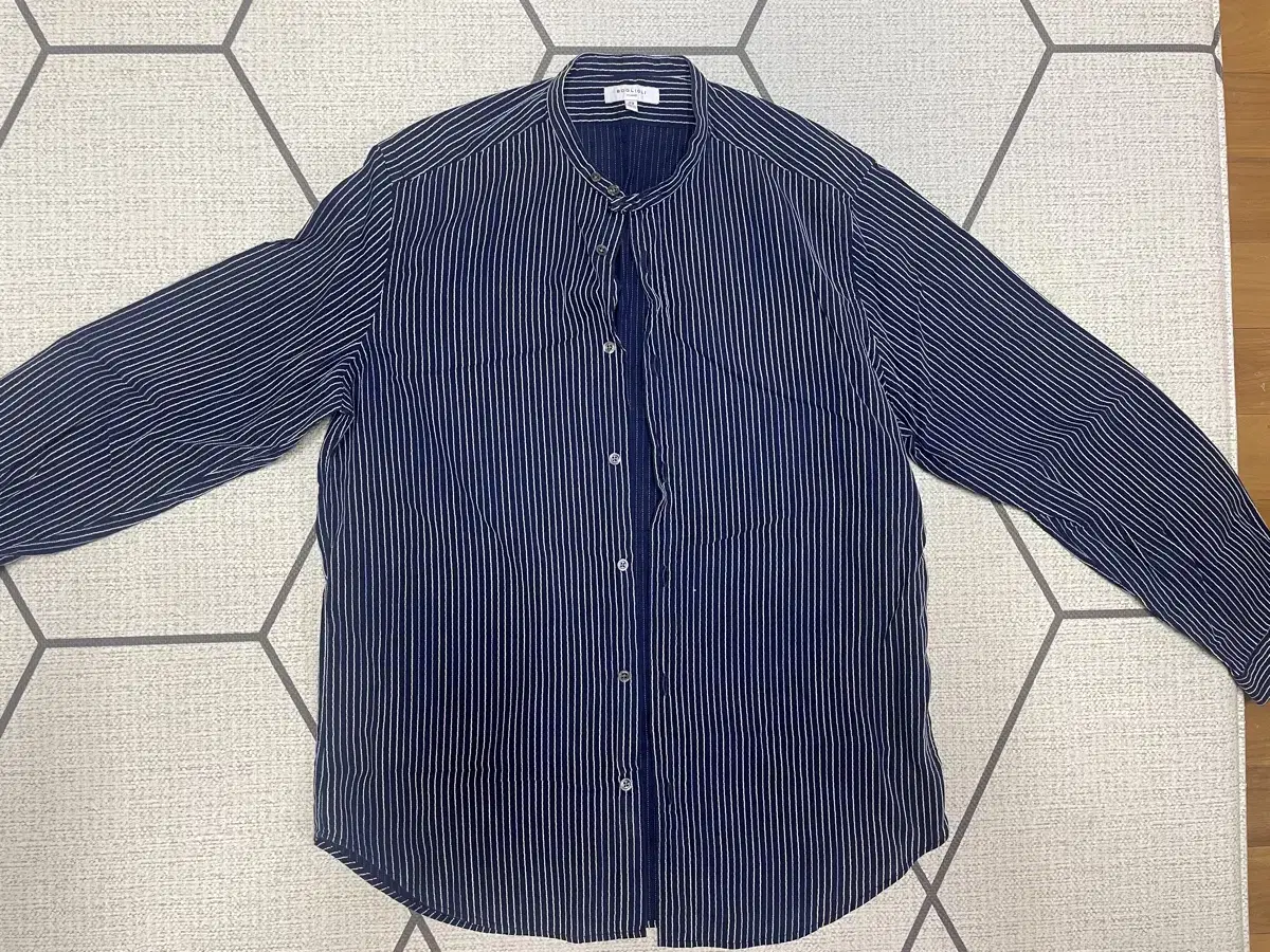 I'm selling a bolioli henley neck striped shirt.