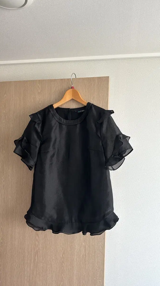 Black ruffled blouse