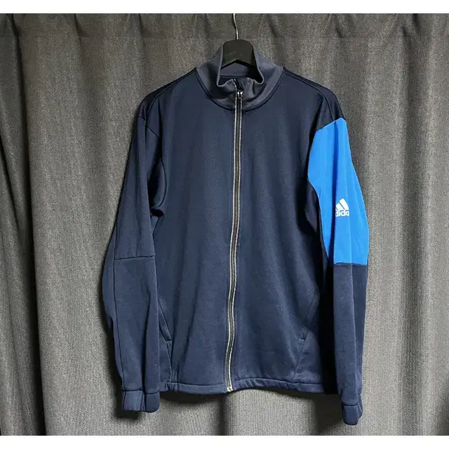 [105] Adidas jersey tracksuit top in navy with a navy cap.