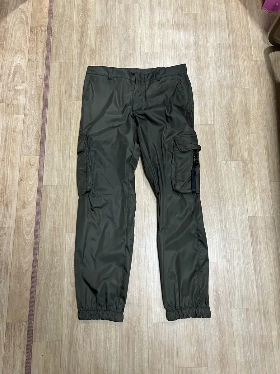 Prada Rina nylon dark khaki pants in size 50 for sale.