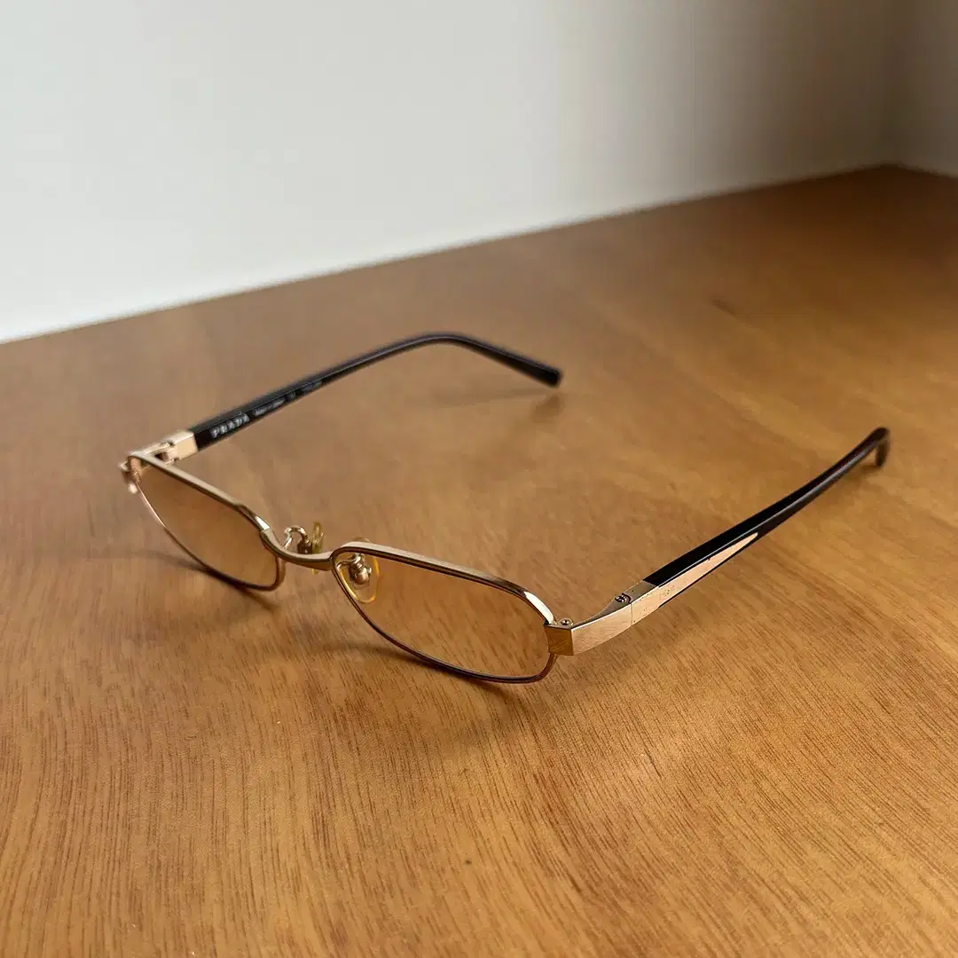 PRADA gold-rimmed glasses