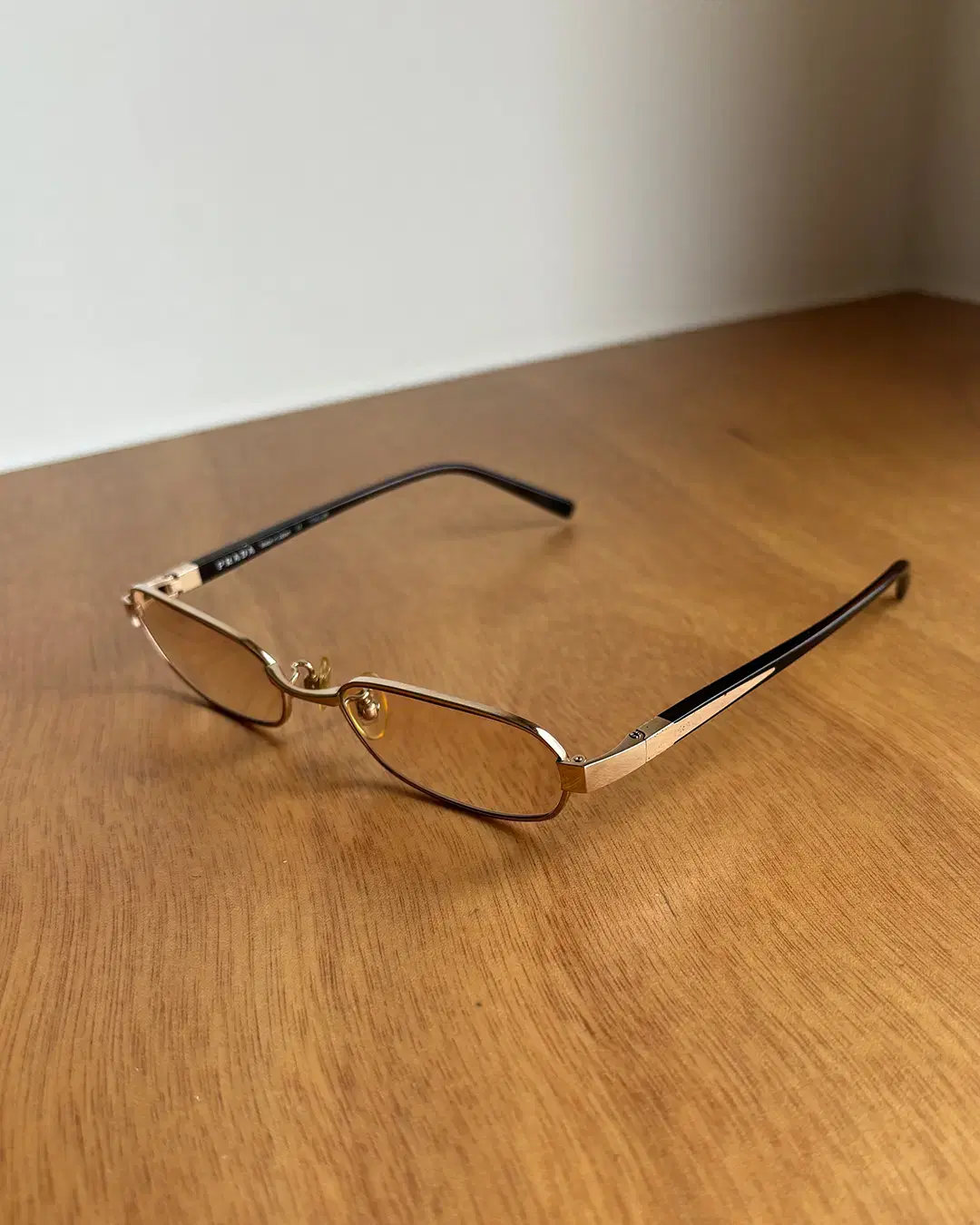 PRADA gold-rimmed glasses