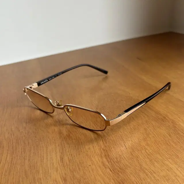 PRADA gold-rimmed glasses