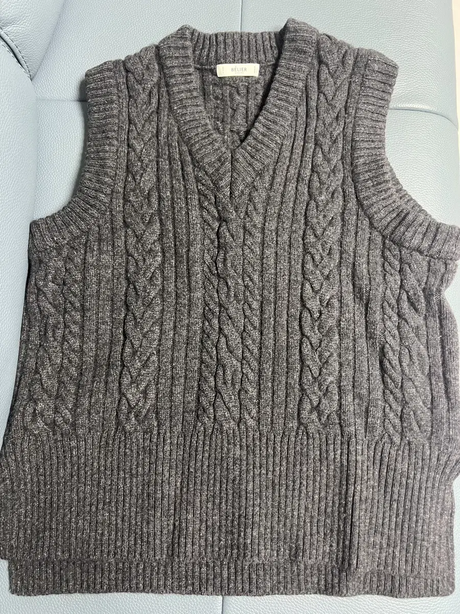 Oversized cable-knit vest at the belle in charcoal