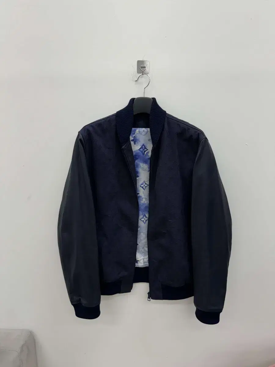 Department store version of the Louis Vuitton Watercolor Leather Varsity Jacket 52 yarns