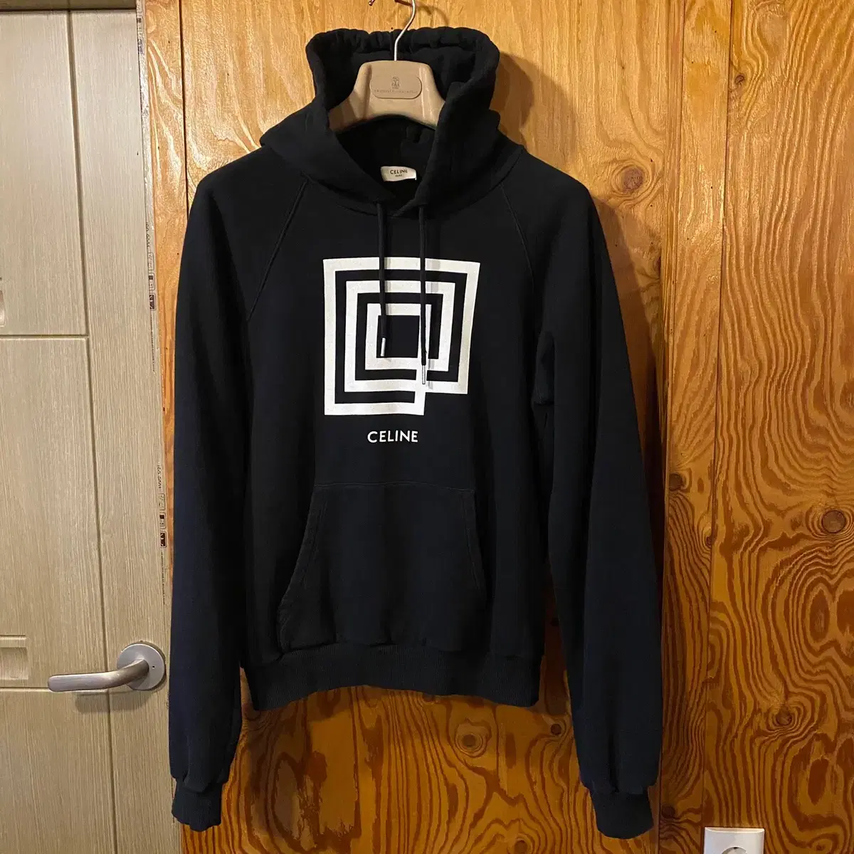 The Seline Graphic Print Square Hoodie is available at sell.