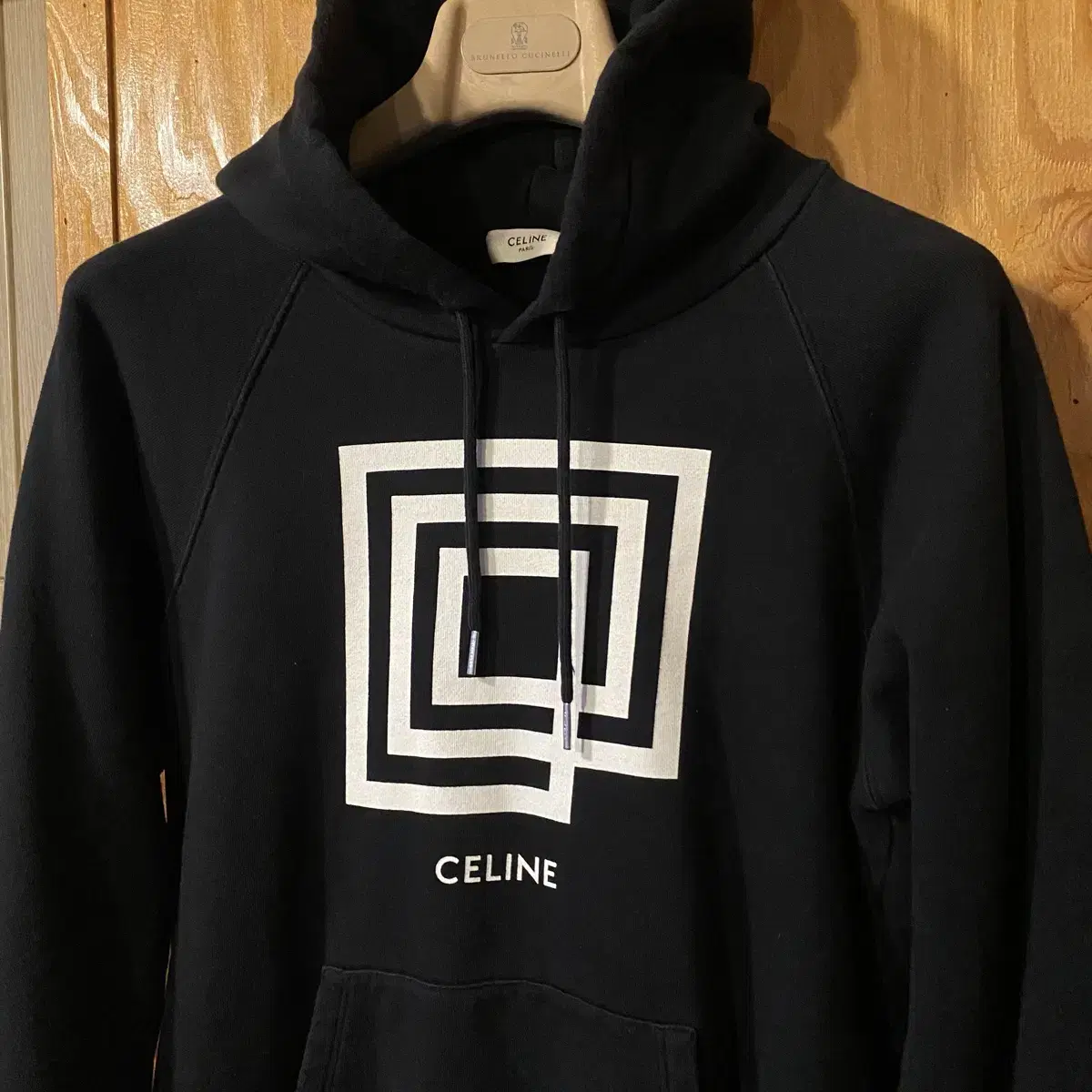 The Seline Graphic Print Square Hoodie is available at sell.