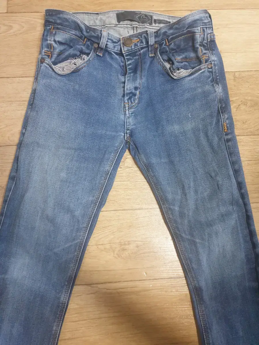 A pair of Evisu jeans in good condition, slim fit 32 inches.