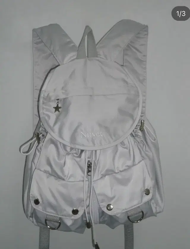 누옛 grey round pocket backpack 가방