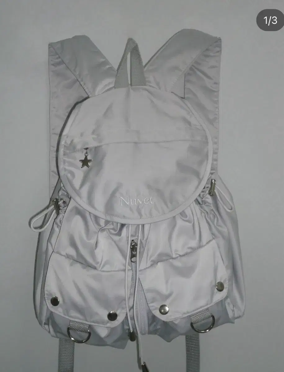 누옛 grey round pocket backpack 가방