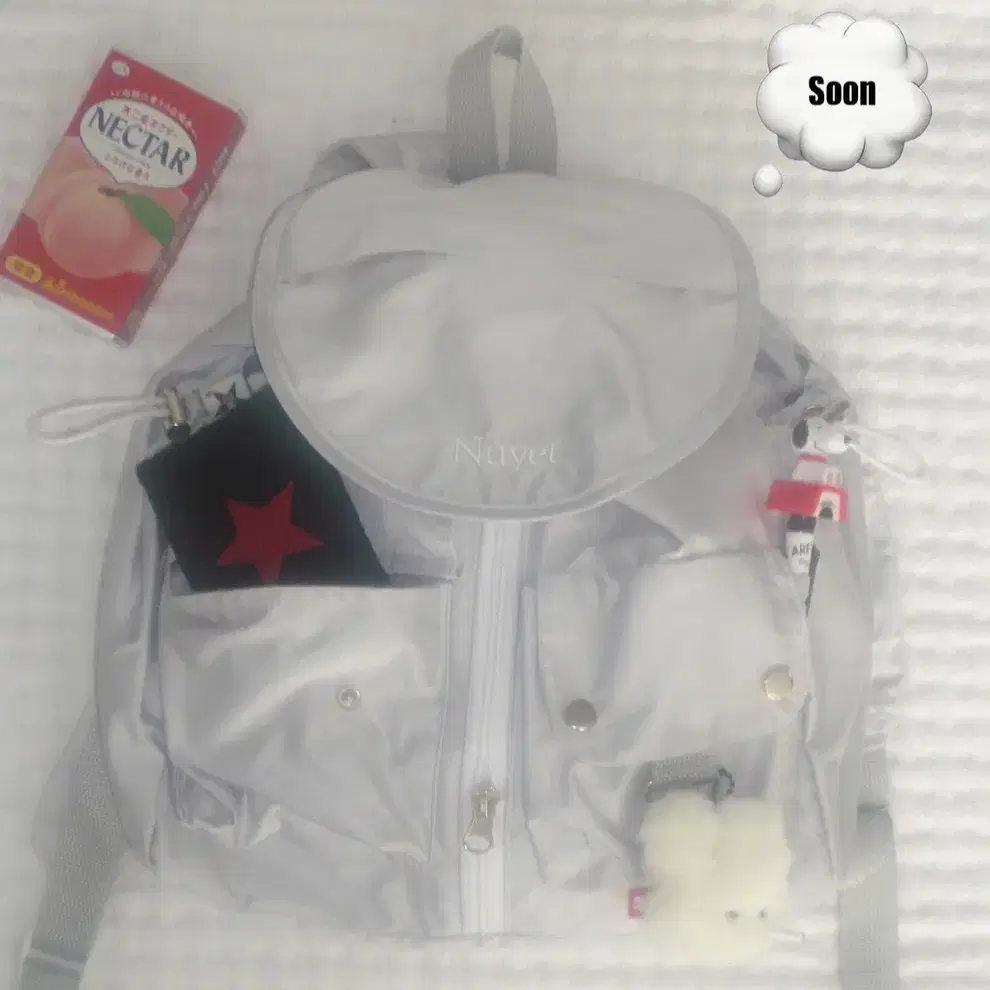 누옛 grey round pocket backpack 가방