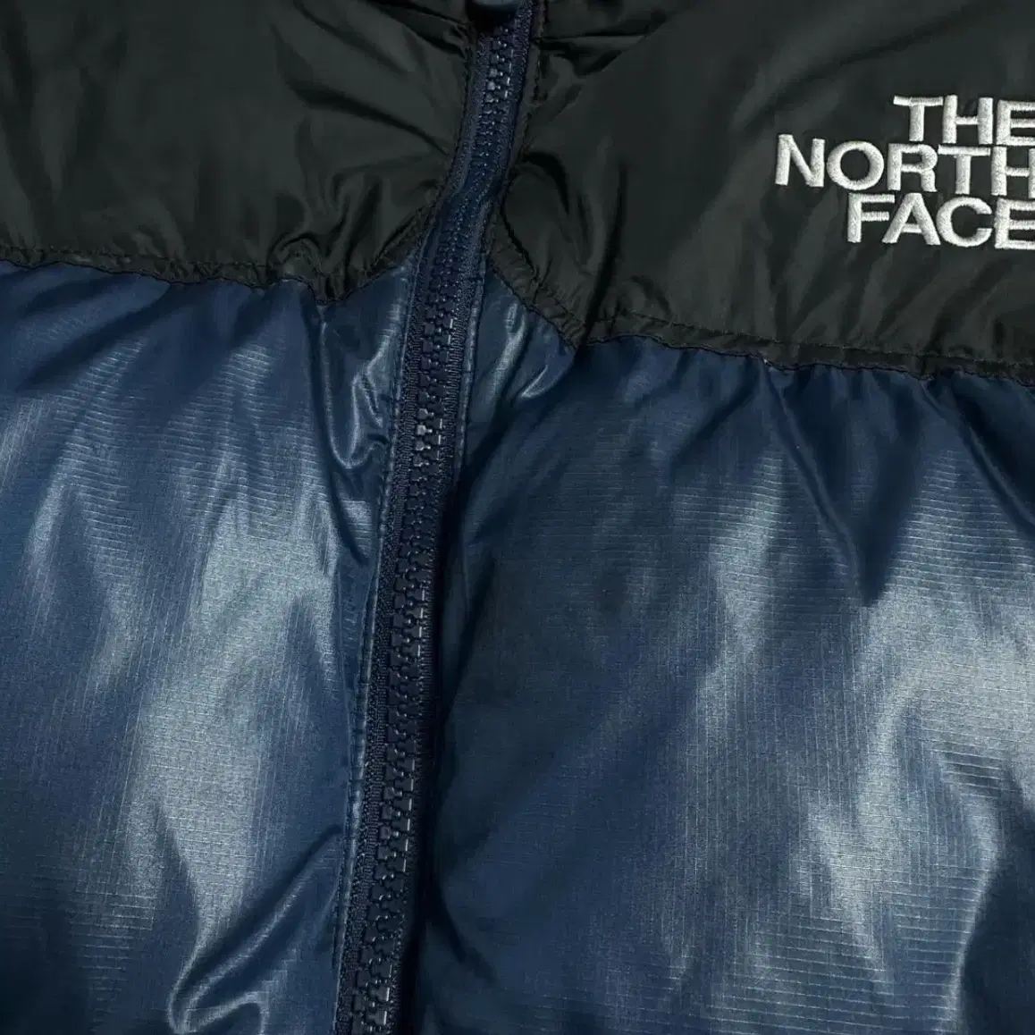 The North Face 눕시 700 다크네이비