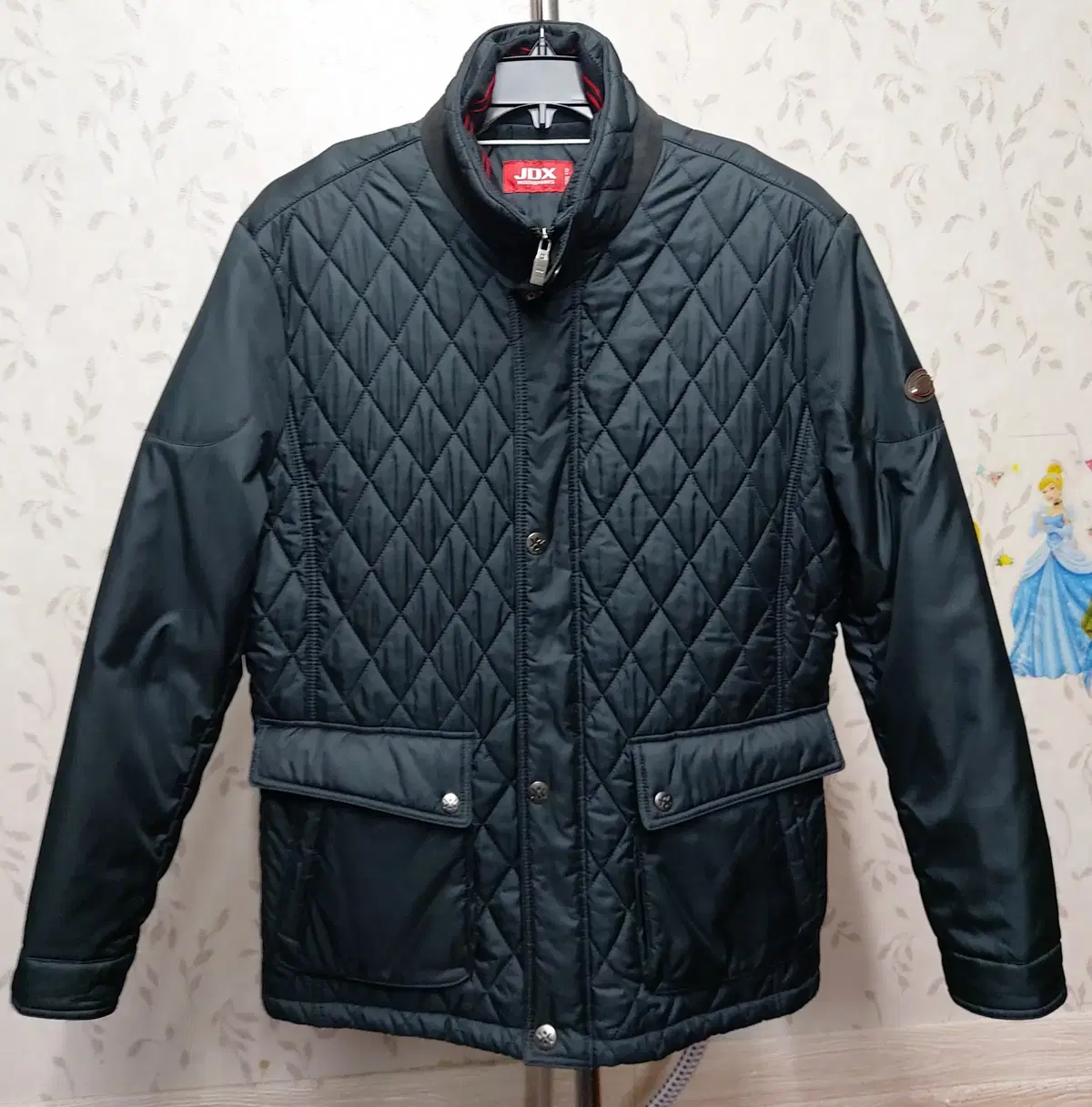 X/Sold/JDX 110 inter-season wellon-filled quilted jacket.